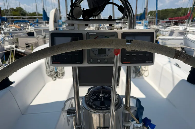 Slide: The Image of Cockpit view of a 1997 Catalina 320 sailboat with navigation instruments. - 5