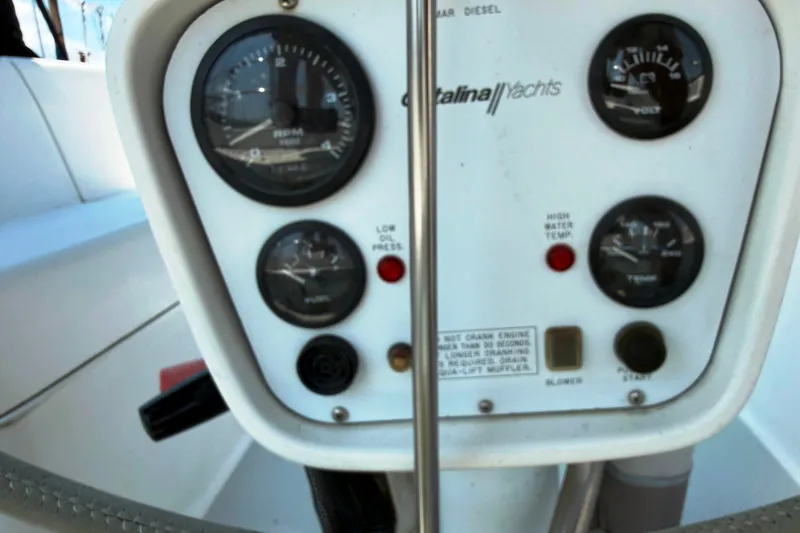 Slide: The Image of Control panel of a 1997 Catalina 320 yacht with gauges and indicators. - 6