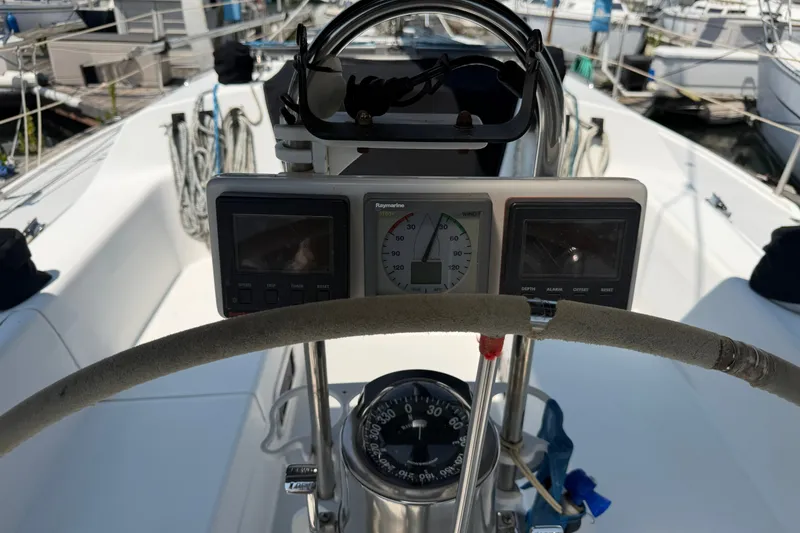 Slide: The Image of Cockpit view of a 1997 Catalina 320 sailboat with navigation instruments. - 4