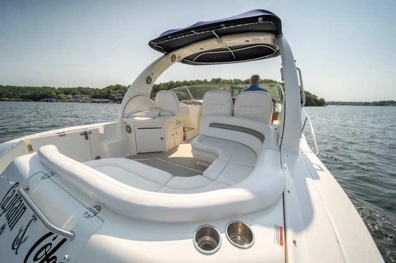 Slide: The Image of 2007 Sea Ray 340 Sundancer cruising on a serene lake with luxurious seating. - 13