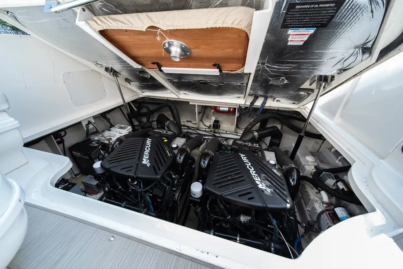 Slide: The Image of Engine compartment of 2007 Sea Ray 340 Sundancer with twin Mercury engines. - 23