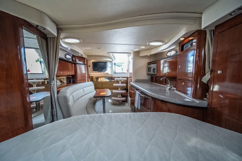 Slide: The Image of Luxurious interior of 2007 Sea Ray 340 Sundancer yacht with elegant wood finishes. - 62