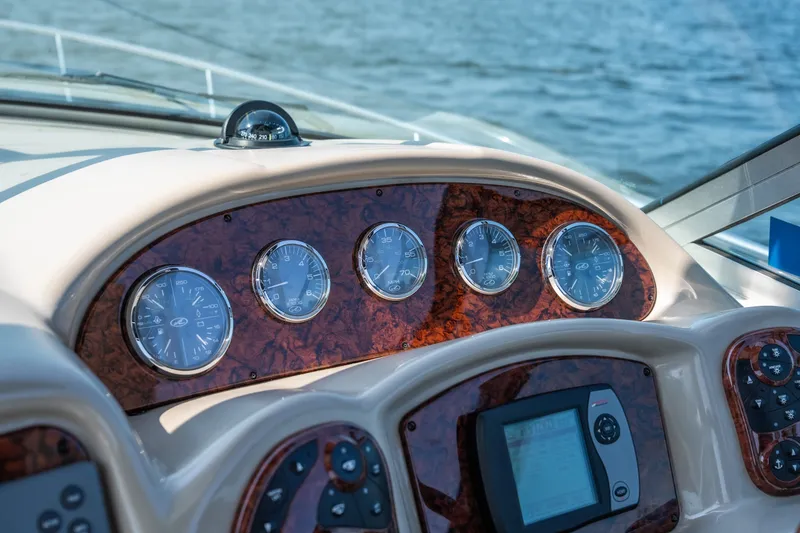 Slide: The Image of Dashboard of a 2007 Sea Ray 340 Sundancer boat with gauges and controls. - 46