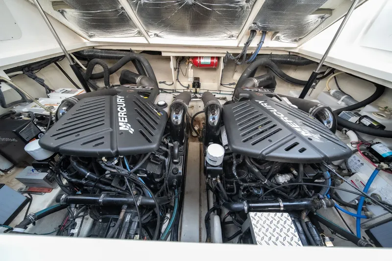 Slide: The Image of Twin Mercury engines in a 2007 Sea Ray 340 Sundancer boat engine compartment. - 24