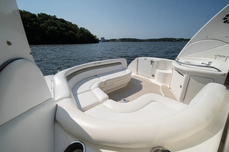 Slide: The Image of Luxurious 2007 Sea Ray 340 Sundancer boat interior with white seating and scenic water view. - 36