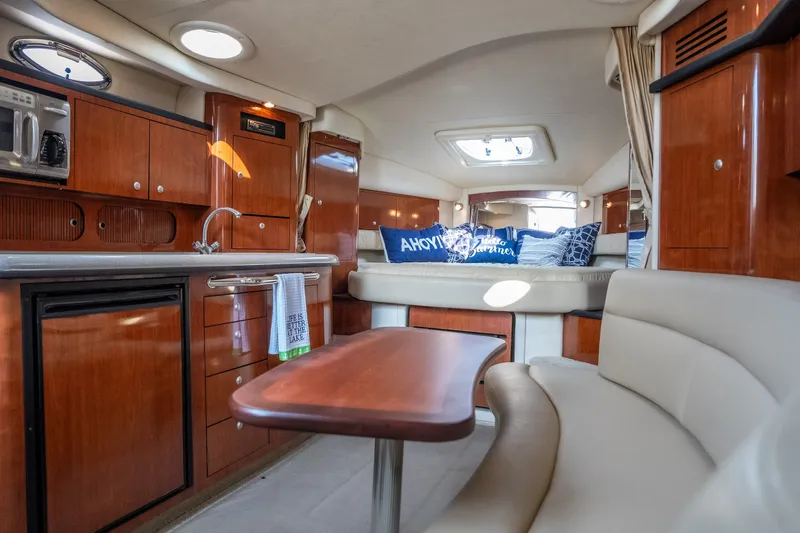 Slide: The Image of Luxurious interior of 2007 Sea Ray 340 Sundancer yacht with wood cabinetry and seating. - 56