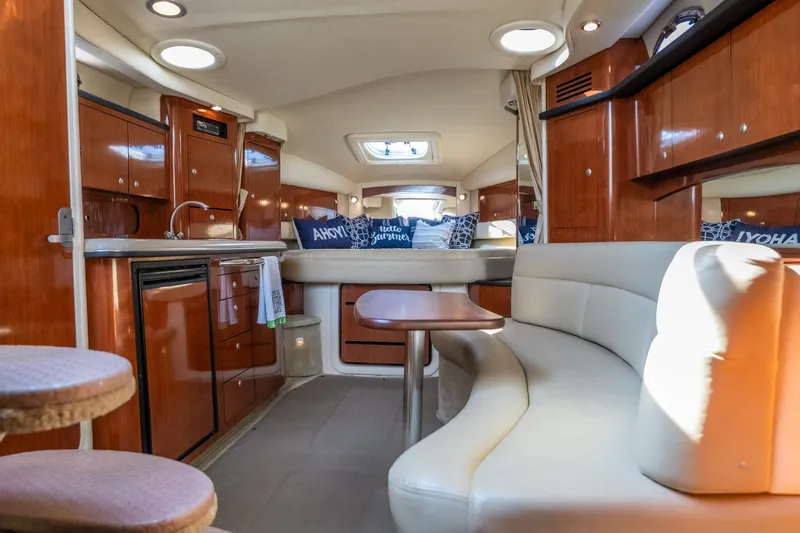 Slide: The Image of Luxurious 2007 Sea Ray 340 Sundancer yacht interior with elegant wood finishes and plush seating. - 51