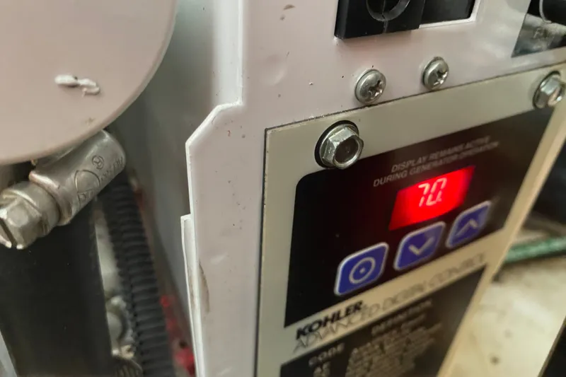 Slide: The Image of Kohler generator control panel on 2007 Sea Ray 340 Sundancer, displaying "70" on screen. - 28
