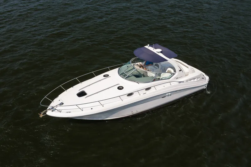 Slide: The Image of 2007 Sea Ray 340 Sundancer yacht cruising on open water. - 6