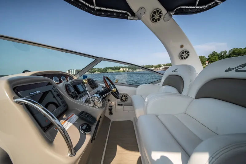 Slide: The Image of 2007 Sea Ray 340 Sundancer cockpit with luxurious seating and advanced navigation controls. - 21
