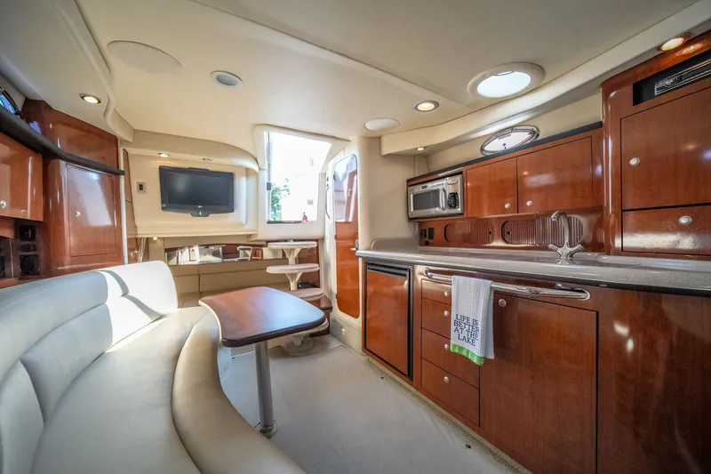 Slide: The Image of Luxurious interior of 2007 Sea Ray 340 Sundancer yacht with modern amenities and elegant wood finishes. - 60