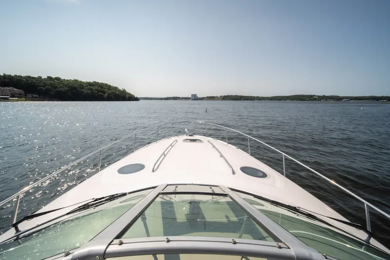 Slide: The Image of Bow view of 2007 Sea Ray 340 Sundancer cruising on a sunny lake. - 64