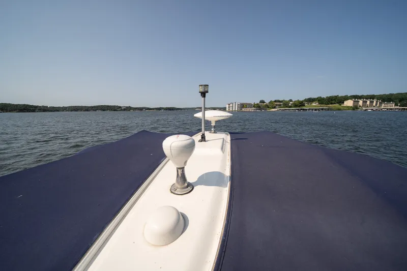 Slide: The Image of 2007 Sea Ray 340 Sundancer cruising on a calm lake under clear blue skies. - 34