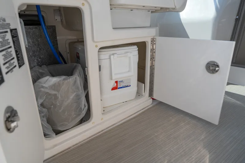Slide: The Image of Storage compartment on 2007 Sea Ray 340 Sundancer with cooler and trash bin. - 45