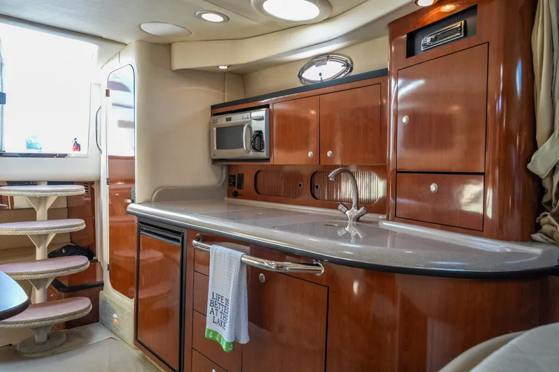 Slide: The Image of Luxurious 2007 Sea Ray 340 Sundancer yacht interior with modern kitchen amenities. - 53