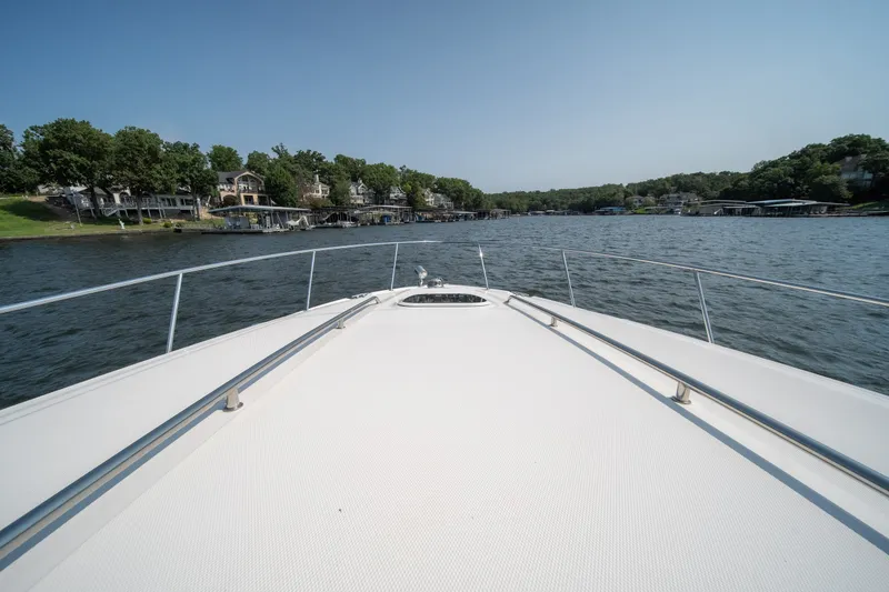 Slide: The Image of Bow view of 2007 Sea Ray 340 Sundancer cruising on a scenic lake. - 31