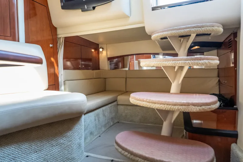 Slide: The Image of Luxurious interior of 2007 Sea Ray 340 Sundancer yacht with plush seating and elegant staircase. - 54