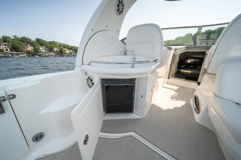 Slide: The Image of 2007 Sea Ray 340 Sundancer boat interior with open storage, lake view, and seating area. - 16