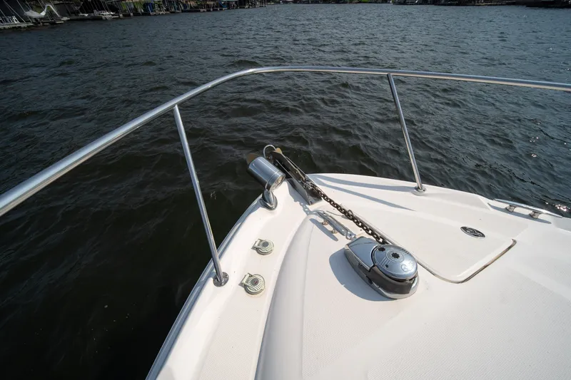 Slide: The Image of Bow of 2007 Sea Ray 340 Sundancer yacht on water, featuring anchor and railing. - 32