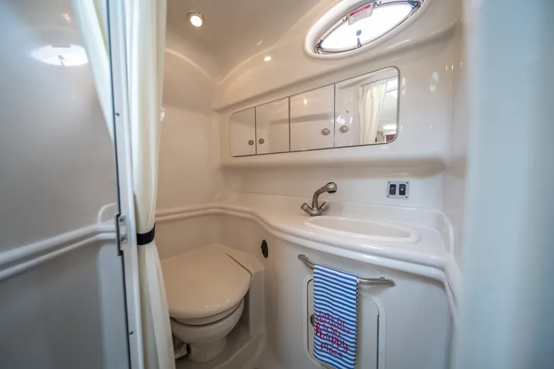 Slide: The Image of Bathroom interior of 2007 Sea Ray 340 Sundancer yacht, featuring sink and storage cabinets. - 59