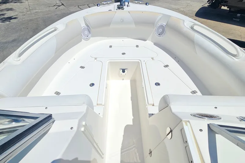 Slide: The Image of 2013 Edgewater 245CX Crossover boat interior with spacious seating and storage compartments. - 23