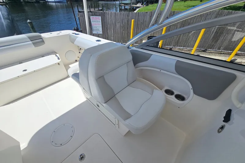 Slide: The Image of Interior of 2013 Edgewater 245CX Crossover boat with comfortable seating and cup holders. - 17