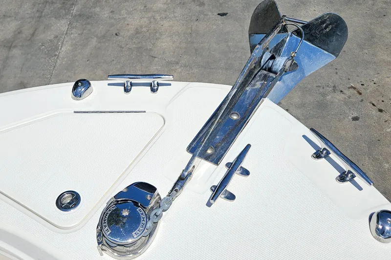 Slide: The Image of Bow of 2013 Edgewater 245CX Crossover boat with anchor and cleats. - 25