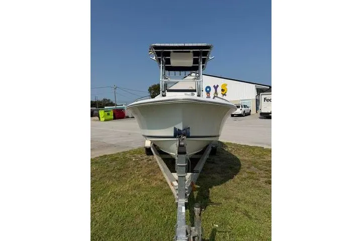 Slide: The Image of 2012 Sea Hunt Triton 177 boat on trailer, parked outdoors. - 2