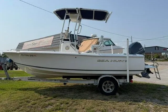 Slide: The Image of 2012 Sea Hunt Triton 177 boat on trailer, parked outdoors. - 4