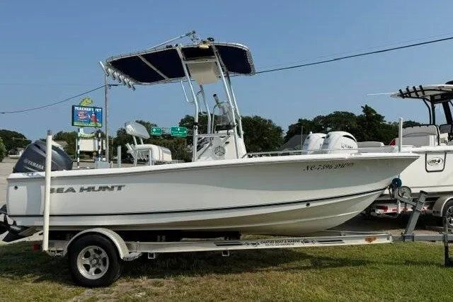 Slide: The Image of 2012 Sea Hunt Triton 177 boat on trailer, parked outdoors, side view. - 8