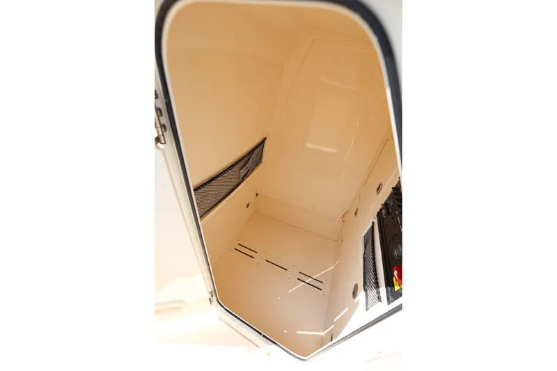 Slide: The Image of 2019 Scout 235 XSF boat storage compartment interior view. - 16