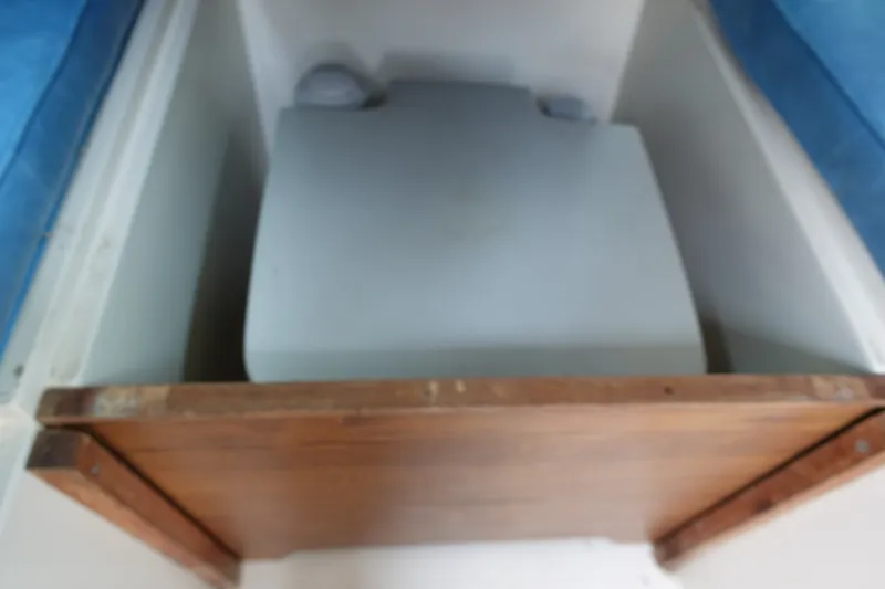 Slide: The Image of 1987 Grady-White Overnighter 206 boat interior with storage compartment. - 16