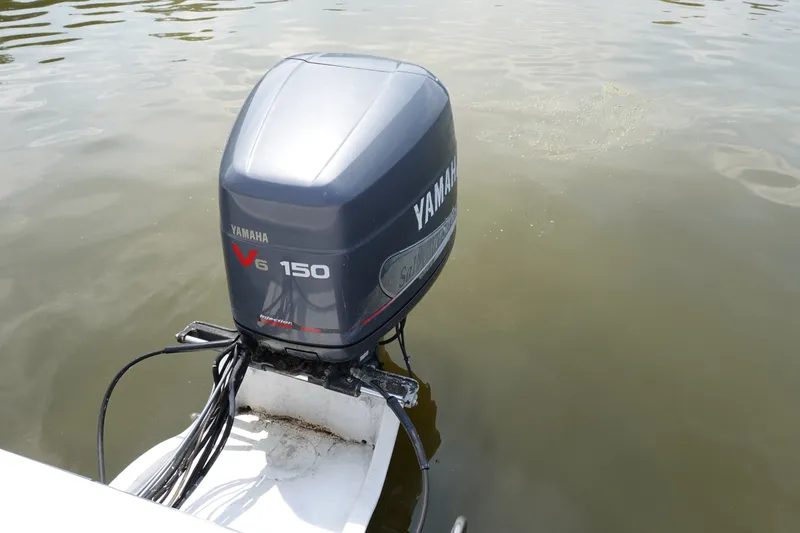 Slide: The Image of Yamaha V6 150 outboard motor on 1987 Grady-White Overnighter 206 boat. - 11
