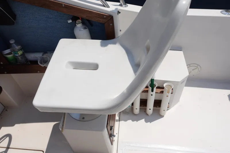 Slide: The Image of 1987 Grady-White Overnighter 206 boat seat with storage and accessories. - 9