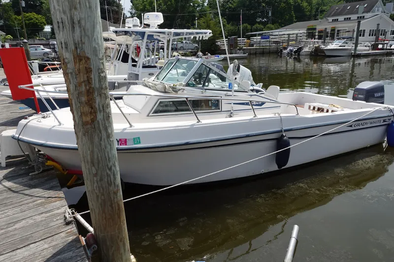 The Image of 1987 Grady-White Overnighter 206 boat docked at marina, side view. - 0
