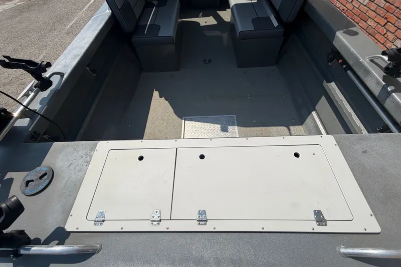 Slide: The Image of 2016 Weldcraft 220 Maverick DV boat interior with seating and storage compartments. - 16