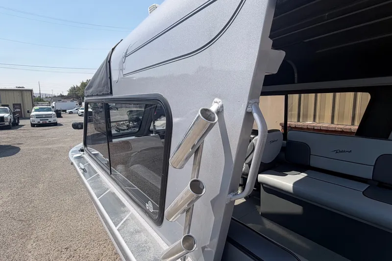 Slide: The Image of 2016 Weldcraft 220 Maverick DV boat with rod holders and interior seating. - 24