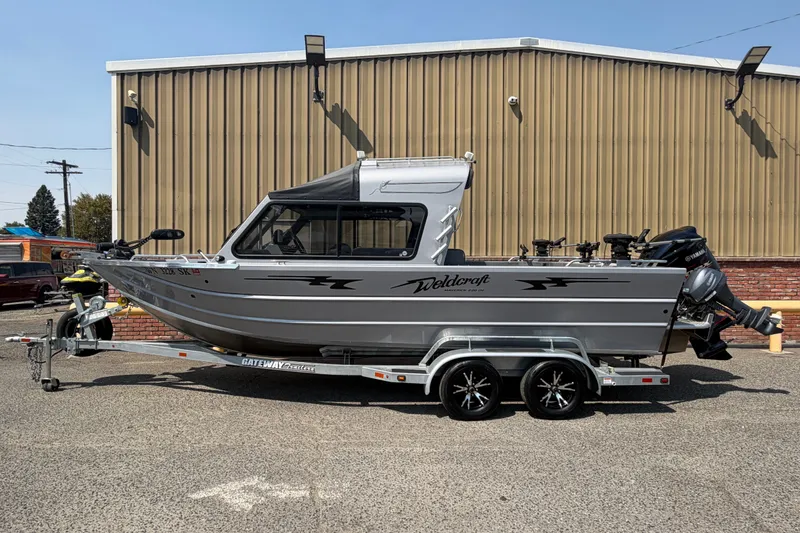 The Image of 2016 Weldcraft 220 Maverick DV boat on trailer, parked outdoors. - 1