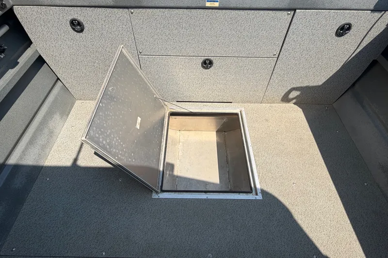 Slide: The Image of Open storage compartment on 2016 Weldcraft 220 Maverick DV boat deck. - 25