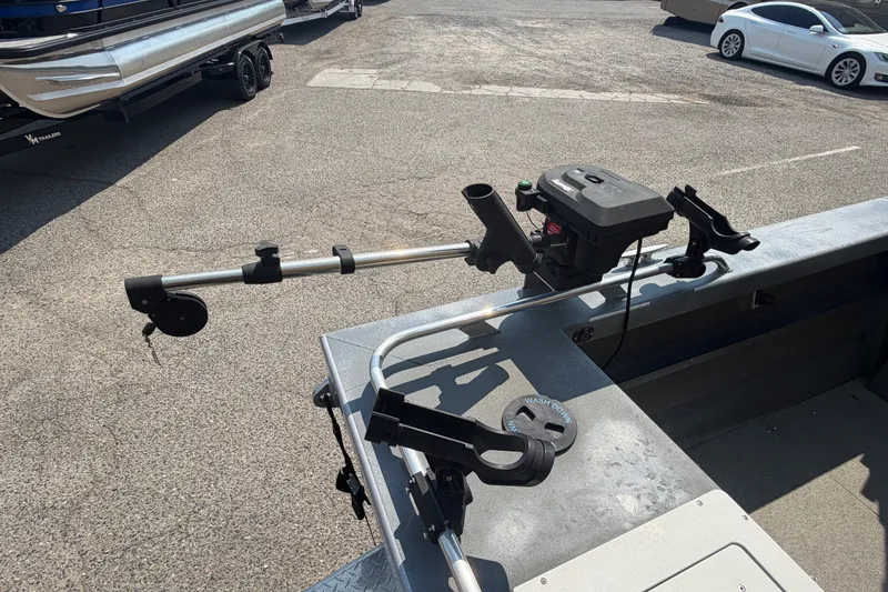 Slide: The Image of 2016 Weldcraft 220 Maverick DV boat with fishing rod holders and equipment on deck. - 15