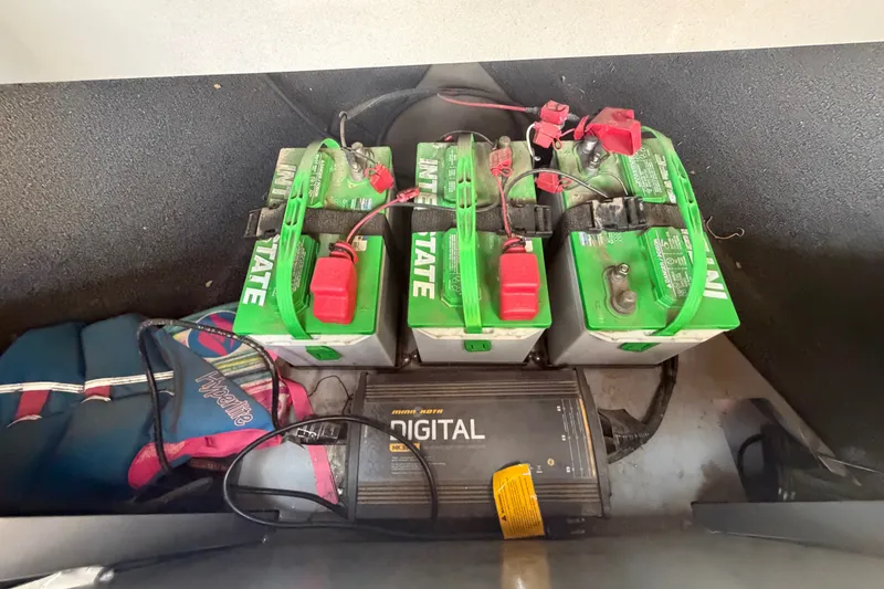 Slide: The Image of Batteries and charger setup in a 2016 Weldcraft 220 Maverick DV boat. - 35
