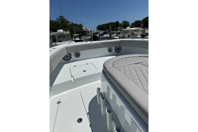 Slide: The Image of Luxurious 2026 Freeman 42LR boat interior with cushioned seating and storage compartments. - 17