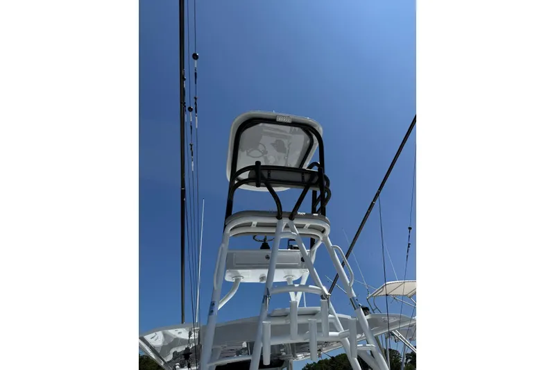 Slide: The Image of Tower view of Freeman 42LR boat, 2026 model, against clear blue sky. - 15