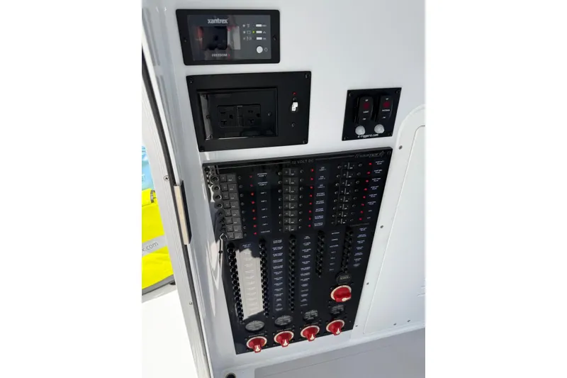 Slide: The Image of Electrical control panel on a 2026 Freeman 42LR boat, featuring Xantrex Freedom components. - 14