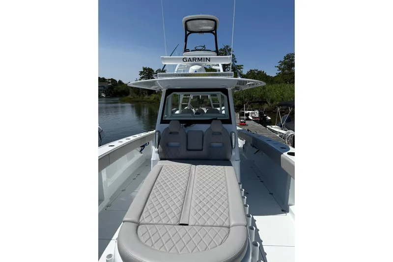 Slide: The Image of 2026 Freeman 42LR boat with Garmin equipment, featuring luxurious seating and sleek design. - 19