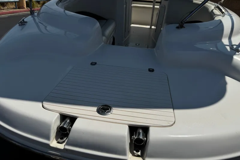 Slide: The Image of 2004 Chaparral Sunesta 212 boat interior, featuring a spacious seating area and sleek design. - 10
