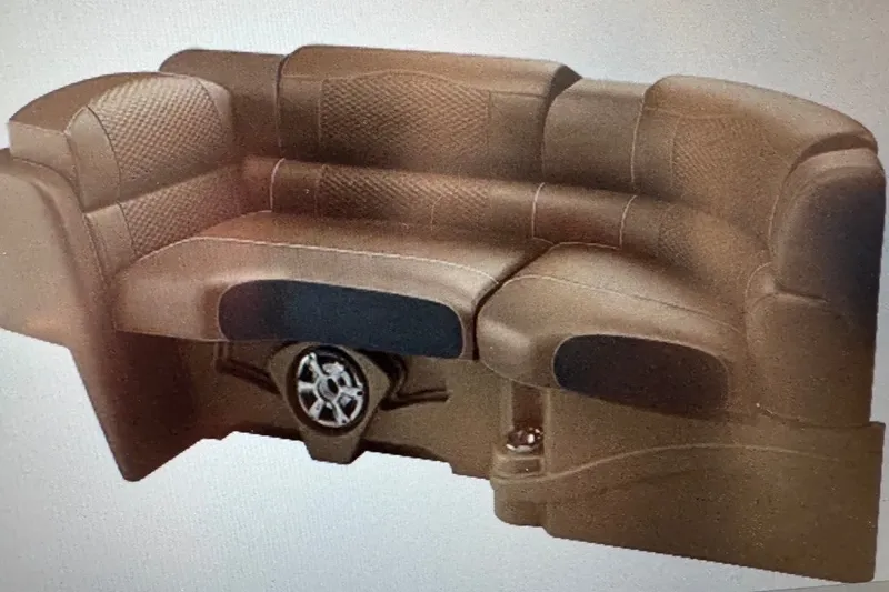 Slide: The Image of Luxurious brown seating in 2027 Avalon Excalibur Quad Lounge, featuring stylish design and speaker integration. - 13