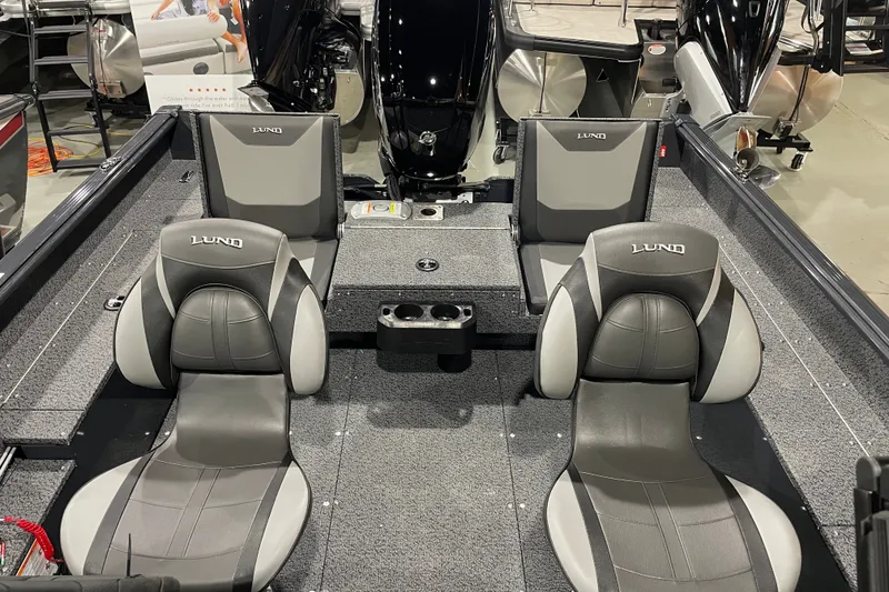 Slide: The Image of 2027 Lund 1700 Adventure Sport boat interior with gray seating and modern design. - 20