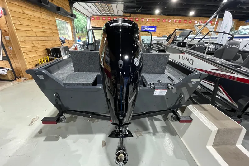 Slide: The Image of 2027 Lund 1700 Adventure Sport boat in showroom, rear view with motor. - 13
