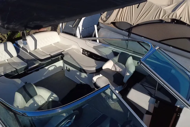 Slide: The Image of 2018 Regal 2300 Bowrider interior with white seating and sleek design. - 21